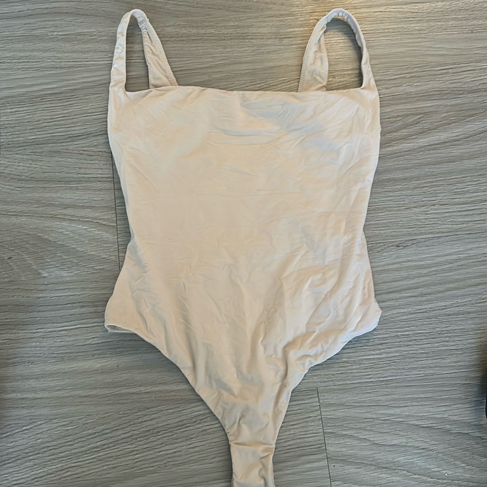 Skims nude body suit size medium